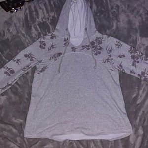 Grey long sleeve sweater with hood and lilac colored flowers